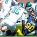 Michigan freshman linebacker Jake Ryan takes down Eastern Michigan wide receiver Kinsman Thomas during the first half against Eastern Michigan at Michigan Stadium on Saturday. Melanie Maxwell I AnnArbor.com